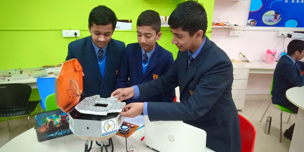 Students building satellite